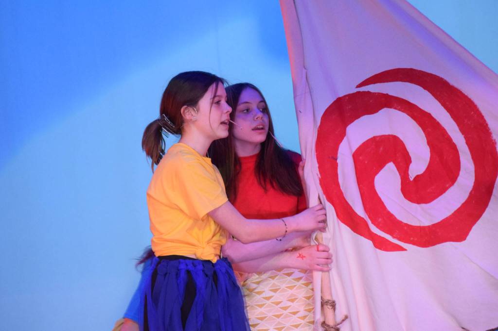 Aislyn Downum, left, and Mylee Yeoman perform a scene from Moana during a dress rehearsal at the Renee C. Henderson Auditorium in Kenai, Alaska, on Wednesday, April 27, 2022. (Camille Botello/Peninsula Clarion)