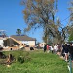 Cook Inlet Academy students clear debris during their mission trip in New Orleans, La., on Friday, March 25, 2022. (Photo courtesy Ginni Hagedorn)