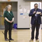 Kenai Peninsula Borough School District Superintendent Clayton Holland, right, speaks at an assembly at Sterling Elementary School honoring Sterling Elementary School Principal Denise Kelly, who was named Alaska Elementary Principal of the Year on Monday, May 2, 2022, in Sterling, Alaska. (Ashlyn OHara/Peninsula Clarion)