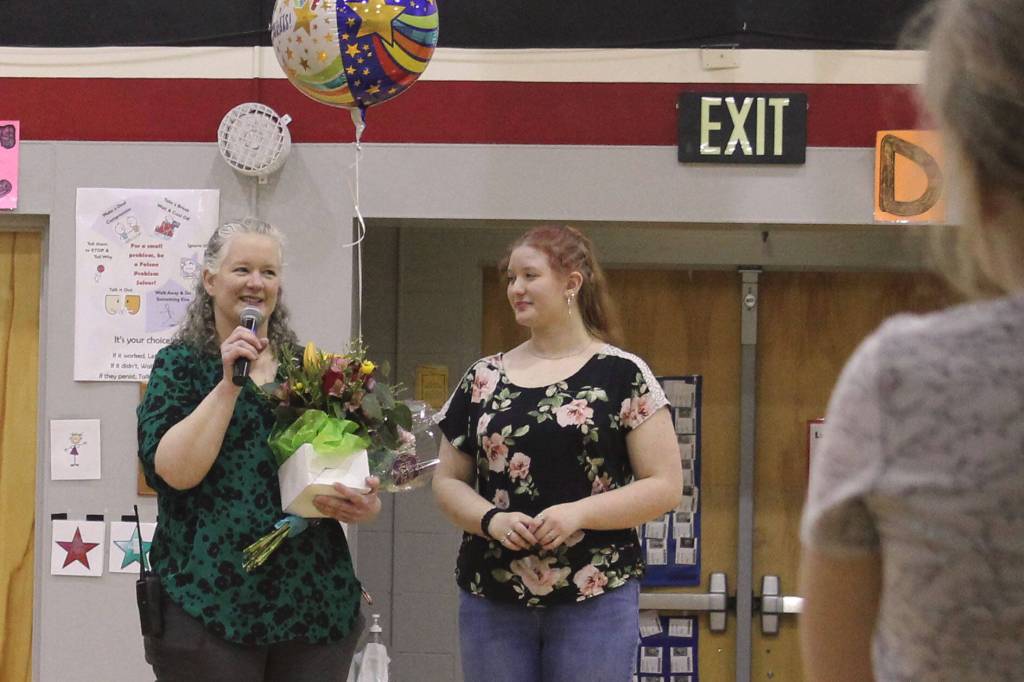 Sterling Elementary School Principal Denise Kelly speaks at a surprise assembly held at the school to celebrate her being named Alaska Elementary Principal of the Year on Monday, May 2, 2022, in Sterling, Alaska. On the right, Kellys daughter, Freya, attends. (Ashlyn OHara/Peninsula Clarion)