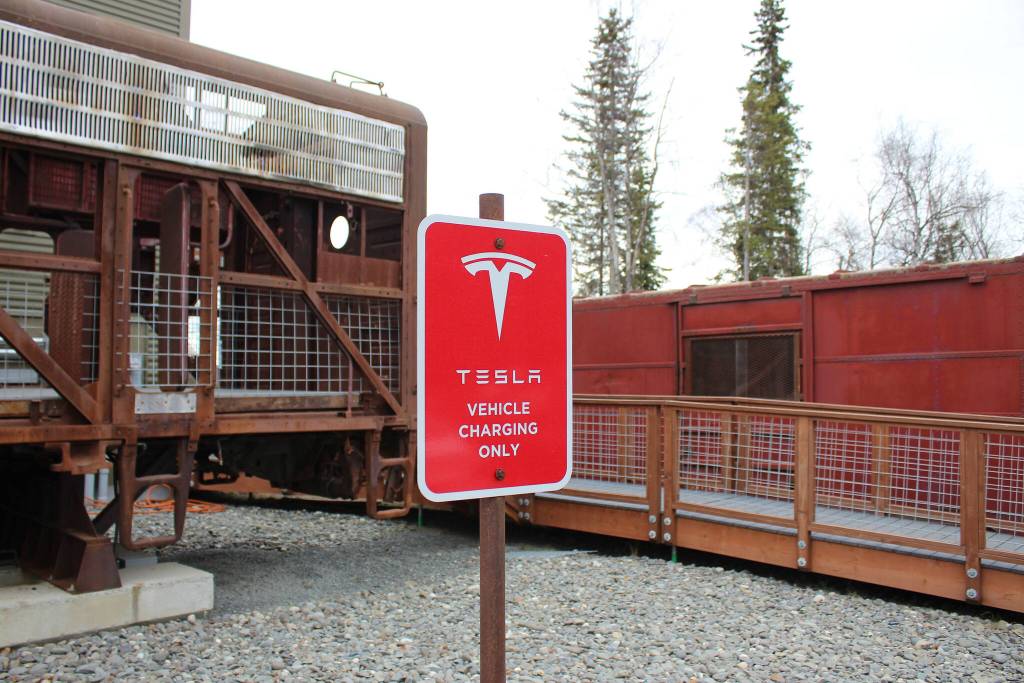 Signage marks the location of a Tesla charging station on Saturday, April 30, 2022, in Soldotna, Alaska. (Ashlyn OHara/Peninsula Clarion)