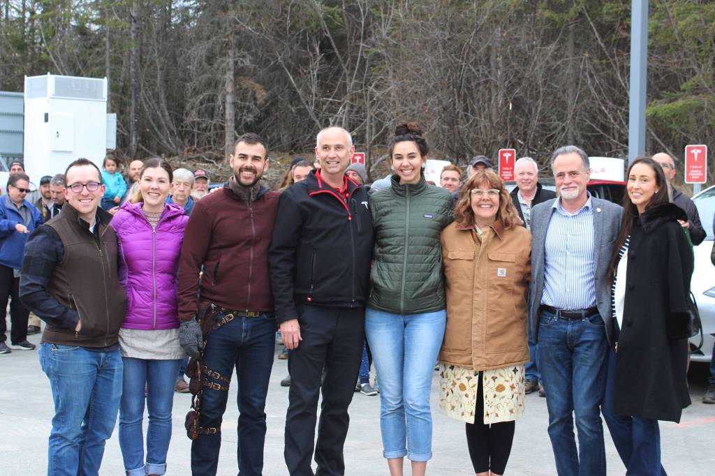 The Krull family poses with State Sen. Peter Micciche and his wife Erin Micciche (far right) during a ribbon cutting ceremony celebrating Alaskas first Tesla Supercharger station on Saturday, April 30, 2022, in Soldotna, Alaska. (Ashlyn OHara/Peninsula Clarion)