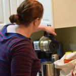 Christina Burns pours a cup of coffee in her Anchorage, Alaska home at around 4 a.m. on Tuesday, May 3, 2022. (Camille Botello/Peninsula Clarion)