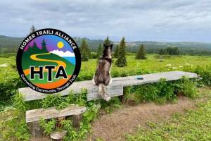 The logo of the Homer Trails Alliance.