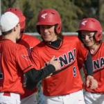 Kenai Central's Simon Grenier (9) celebrates his grand slam against Soldotna with teammates at the Soldotna Little League fields Wednesday, May 4, 2022, in Soldotna, Alaska. (Photo by Jeff Helminiak/Peninsula Clarion)