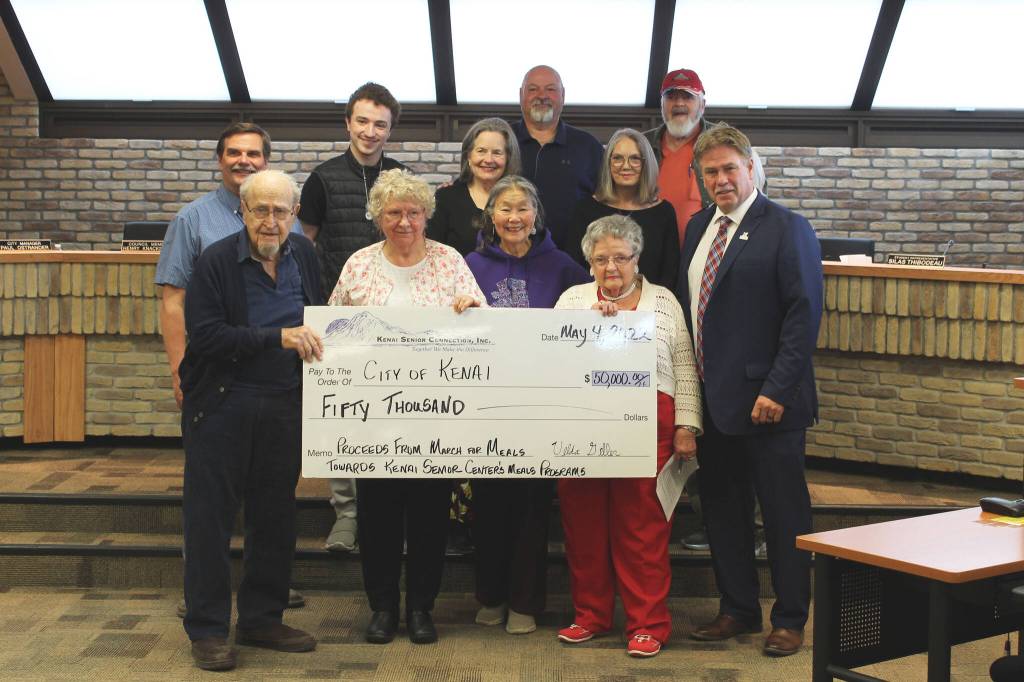Kenai City Council members on behalf of the city accept check for $50,000 from Kenai Senior Connection Inc. during a council meeting on Wednesday, May 4, 2022, in Kenai, Alaska. (Ashlyn OHara/Peninsula Clarion)