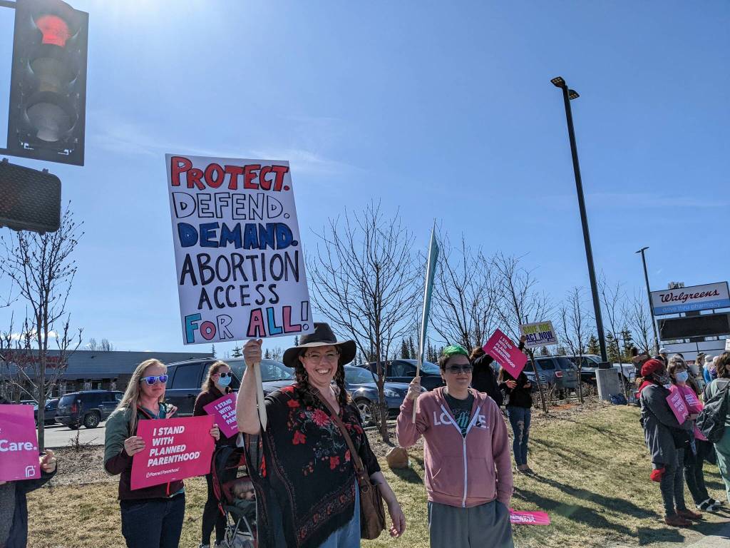 Demonstrators in support of abortion rights stand at the intersection of the Kenai and Sterling highways on Saturday, May 7, 2022, in Soldotna, Alaska. (Photo by Erin Thompson/Peninsula Clarion)
