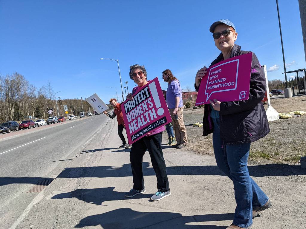 Demonstrators in support of abortion rights stand at the intersection of the Kenai and Sterling highways on Saturday, May 7, 2022, in Soldotna, Alaska. (Photo by Erin Thompson/Peninsula Clarion)