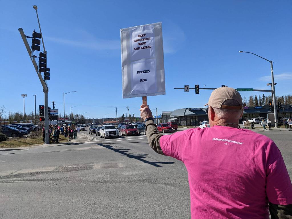 Demonstrators in support of abortion rights stand at the intersection of the Kenai and Sterling highways on Saturday, May 7, 2022, in Soldotna, Alaska. (Photo by Erin Thompson/Peninsula Clarion)