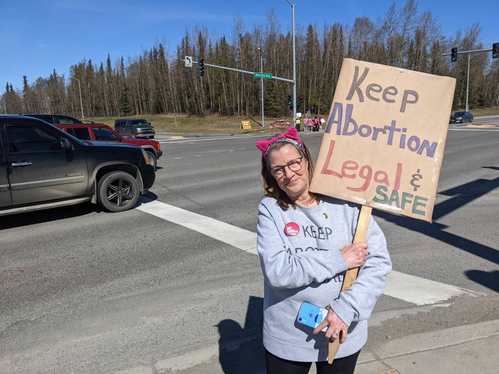 Michele Vasquez rallies in support of abortion rights stand at the intersection of the Kenai and Sterling highways on Saturday, May 7, 2022, in Soldotna, Alaska. (Photo by Erin Thompson/Peninsula Clarion)