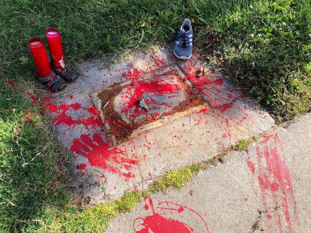 Red painted handprints cover the empty spot at a park in Albuquerque, New Mexico, on Thursday, July 1, 2021, where a historical marker for the Indigenous children who died while attending a boarding school nearby was removed. The U.S. Interior Department is expected to release a report Wednesday, May 11, 2022, that it says will begin to uncover the truth about the federal governments past oversight of Native American boarding schools. (AP Photo/Susan Montoya Bryan,File)