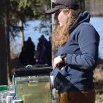 Kaitlynn Cafferty, a habitat biologist with the Alaska Department of Fish and Game, teaches kids about fish species at the 21st annual Kenai Peninsula Salmon Celebration in Kasilof on Wednesday, May 11, 2022. (Camille Botello/Peninsula Clarion)