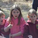 From left to right: Archer Shack, Presley Jackson and Kamryn Best wait in line before releasing their rainbow trout at the 21st annual Kenai Peninsula Salmon Celebration in Kasilof on Wednesday, May 11, 2022. (Camille Botello/Peninsula Clarion)