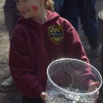 Kamryn Best waits in line before releasing her rainbow trout at the 21st annual Kenai Peninsula Salmon Celebration in Kasilof on Wednesday, May 11, 2022. (Camille Botello/Peninsula Clarion)