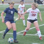Soldotnas Sadie Lane dribbles against Houstons Lilly Christensen on Thursday, May 12, 2022, at Justin Maile Field at Soldotna High School in Soldotna, Alaska. (Photo by Jeff Helminiak/Peninsula Clarion)
