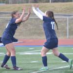 Soldotnas Katharine Bramante and Liberty Miller celebrate Millers goal against Houston on Thursday, May 12, 2022, at Justin Maile Field at Soldotna High School in Soldotna, Alaska. (Photo by Jeff Helminiak/Peninsula Clarion)