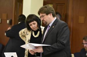 Sens. Shelley Hughes, R-Palmer, left, and Robert Myers, R-North Pole, read through one of 41 amendments submitted to the states omnibus budget bill being debate on the floor of the Alaska State Senate on Monday, May 9, 2022. (Peter Segall / Juneau Empire)