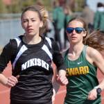 Nikiskis Rylee Ellis and Sewards Hailey Ingalls duel in the 800 meters at the Kenai Peninsula Borough meet Saturday, May 14, 2022, at Justin Maile Field at Soldotna High School in Soldotna, Alaska. (Photo by Jeff Helminiak/Peninsula Clarion)