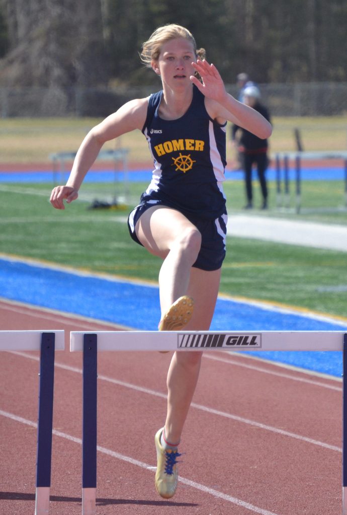 Homers Gracie Miotke wins the 300 hurdles at the Kenai Peninsula Borough meet Saturday, May 14, 2022, at Justin Maile Field at Soldotna High School in Soldotna, Alaska. (Photo by Jeff Helminiak/Peninsula Clarion)