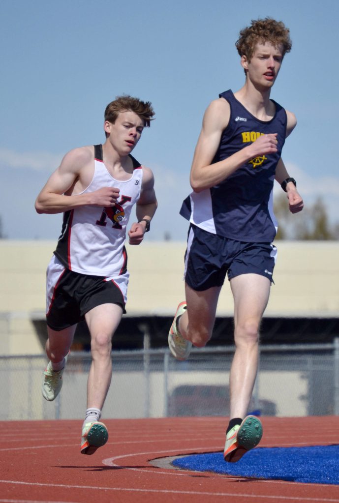 Homers Seamus McDonough was first and Kenai Centrals Greg Fallon was second in the 1,600 meters at the Kenai Peninsula Borough meet Saturday, May 14, 2022, at Justin Maile Field at Soldotna High School in Soldotna, Alaska. (Photo by Jeff Helminiak/Peninsula Clarion)