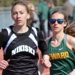 Nikiski's Rylee Ellis and Seward's Hailey Ingalls duel in the 800 meters at the Kenai Peninsula Borough meet Saturday, May 14, 2022, at Justin Maile Field at Soldotna High School in Soldotna, Alaska. (Photo by Jeff Helminiak/Peninsula Clarion)