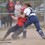 Soldotna catcher Bailey Conner tags out Kenai Central's Kailey Stynsberg on Monday, May 16, 2022, at the Soldotna Little League fields in Soldotna, Alaska. (Photo by Jeff Helminiak/Peninsula Clarion)