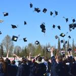 Graduates throw their caps into the air at the end of Soldotna High Schools commencement ceremony on Wednesday, May 18, 2022, in Soldotna, Alaska. (Ashlyn OHara/Peninsula Clarion)