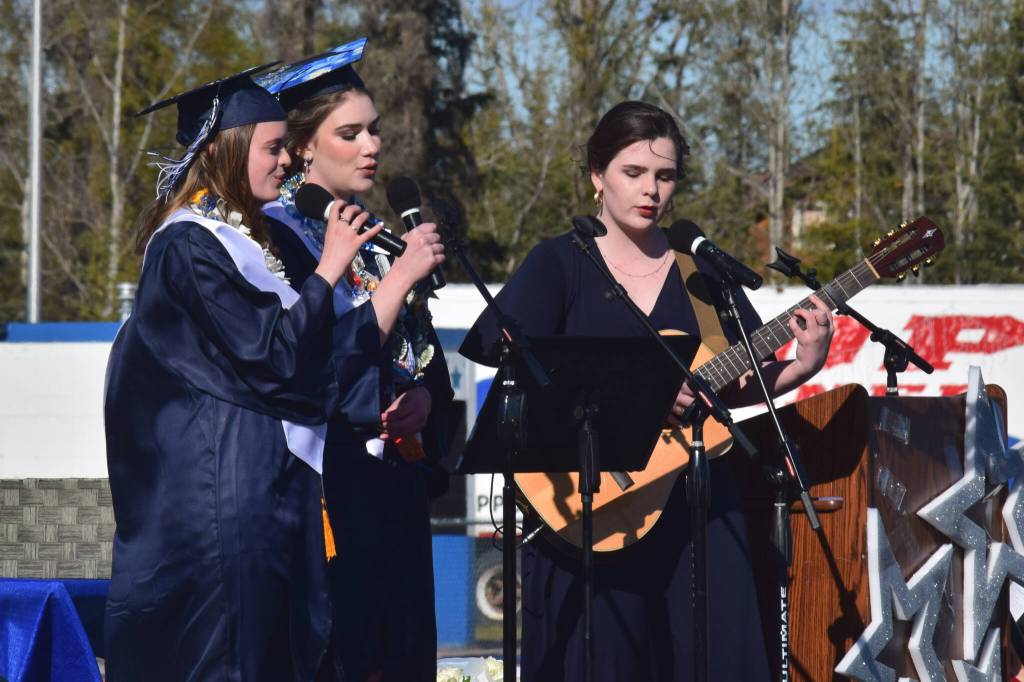 From left: Gabrielle Lane, Regan Evans and Evelyn Wilcox perform a rendition of Nora Jones Sunrise during Soldotna High Schools commencement ceremony on Wednesday, May 18, 2022, in Soldotna, Alaska. (Ashlyn OHara/Peninsula Clarion)