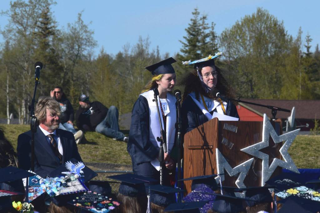 Soldotna High School Valedictorians Ivy Daily, left, and Alissa Powell speak during the schools commencement ceremony on Wednesday, May 18, 2022, in Soldotna, Alaska. (Ashlyn OHara/Peninsula Clarion)