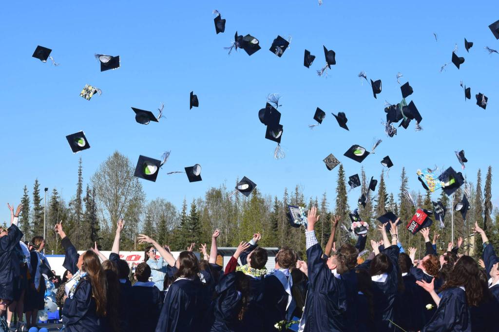 Graduates throw their caps into the air at the end of Soldotna High Schools commencement ceremony on Wednesday, May 18, 2022, in Soldotna, Alaska. (Ashlyn OHara/Peninsula Clarion)