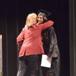 Deborah Weisser, right, accepts an award from the Homer Elks Lodge during Connections Homeschools commencement ceremony on Thursday, May 19, 2022, in Soldotna, Alaska. (Ashlyn OHara/Peninsula Clarion)