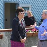 Cook Inlet Region, Inc. President and CEO Sophie Minich, left, and Kenai Peninsula Foundation President Tim Navarre (right) speak during a ribbon cutting ceremony at the Nikiski Shelter of Hope on Friday, May 20, 2022, in Nikiski, Alaska. (Ashlyn OHara/Peninsula Clarion)