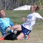 Nikiski goalie Emma Weeks makes a save on Homers Lily King on Friday, May 20, 2022, at the Peninsula Conference soccer tournament at Nikiski High School in Nikiski, Alaska. (Photo by Jeff Helminiak/Peninsula Clarion)