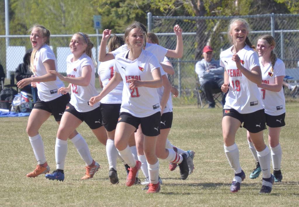 The Kenai Central girls celebrate Seanna Swansons game-winning goal in the Peninsula Conference championship game Saturday, May 21, 2022, at Nikiski High School in Nikiski, Alaska. (Photo by Jeff Helminiak/Peninsula Clarion)