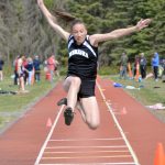 Nikiskis Rylee Ellis competes in the long jump at the Region 3/Division II meet Saturday, May 21, 2022, at Ed Hollier Field at Kenai Central High School in Kenai, Alaska. (Photo by Jeff Helminiak/Peninsula Clarion)