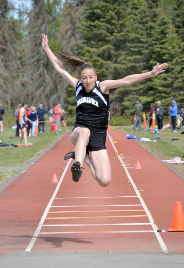 Nikiskis Rylee Ellis competes in the long jump at the Region 3/Division II meet Saturday, May 21, 2022, at Ed Hollier Field at Kenai Central High School in Kenai, Alaska. (Photo by Jeff Helminiak/Peninsula Clarion)