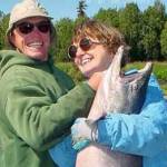 A Kenai River fisherman and his mother celebrate a successful catch. (Photo by Boo Kandas)