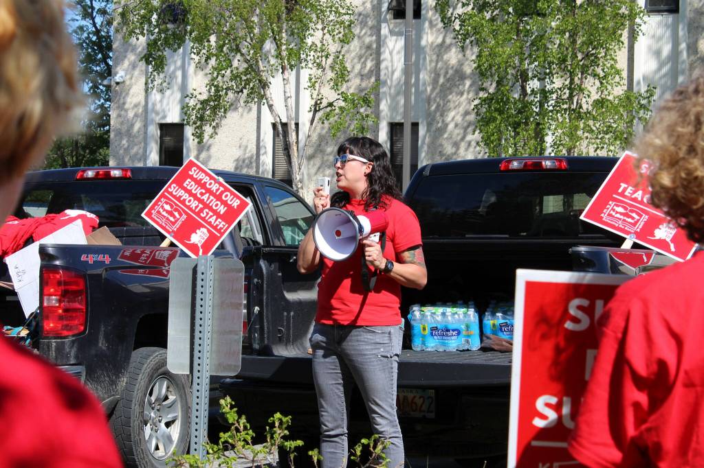 Rebecca Dixon speaks in support of Kenai Peninsula Borough School District teachers and support staff during a rally outside of the George A. Navarre Admin Building on Thursday, May 26, 2022 in Soldotna, Alaska. (Ashlyn OHara/Peninsula Clarion)