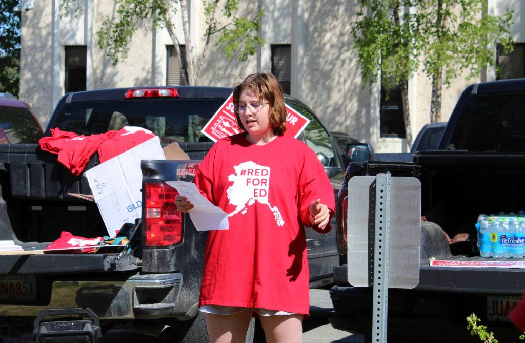 Former Kenai Peninsula Borough School District student Olivia Davis speaks in support of district teachers and staff during a rally outside of the George A. Navarre Admin Building on Thursday, May 26, 2022 in Soldotna, Alaska. (Ashlyn OHara/Peninsula Clarion)