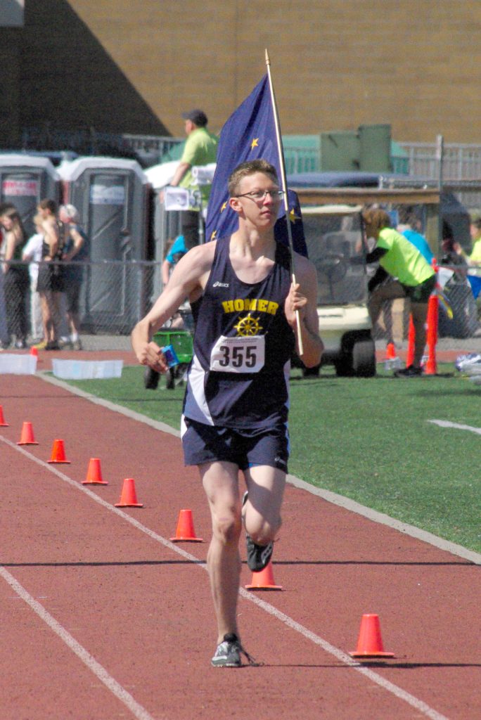 Homers Caleb Evans is recognized for winning the boys Division II high jump Saturday, May 28, 2022, at the Division II state track and field meet at Dimond High School in Anchorage, Alaska. (Photo by Jeff Helminiak/Peninsula Clarion)