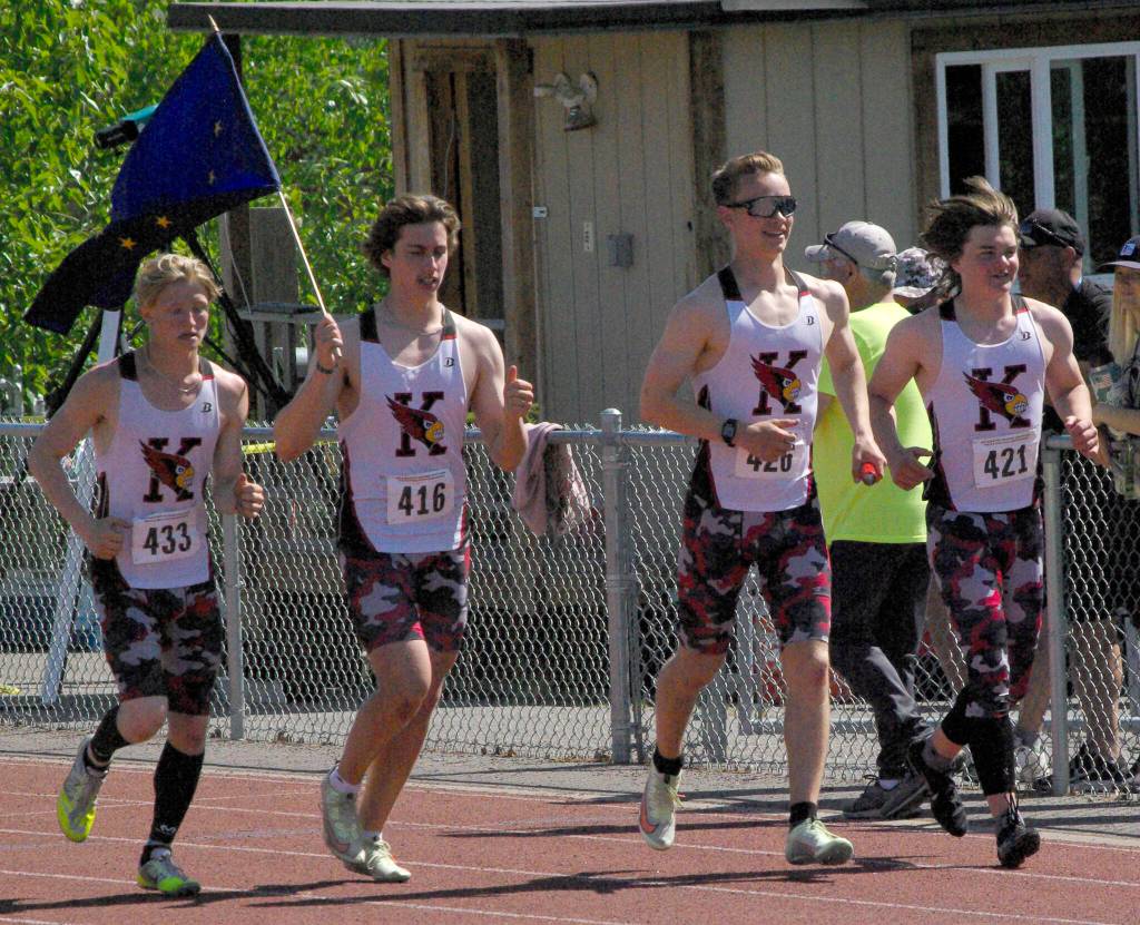 Kenai Centrals James Sparks, Jacob Begich, Tyler Hippchen and Reagan Graves celebrate after winning the boys Division II 400-meter relay Saturday, May 28, 2022, at the Division II state track and field meet at Dimond High School in Anchorage, Alaska. (Photo by Jeff Helminiak/Peninsula Clarion)