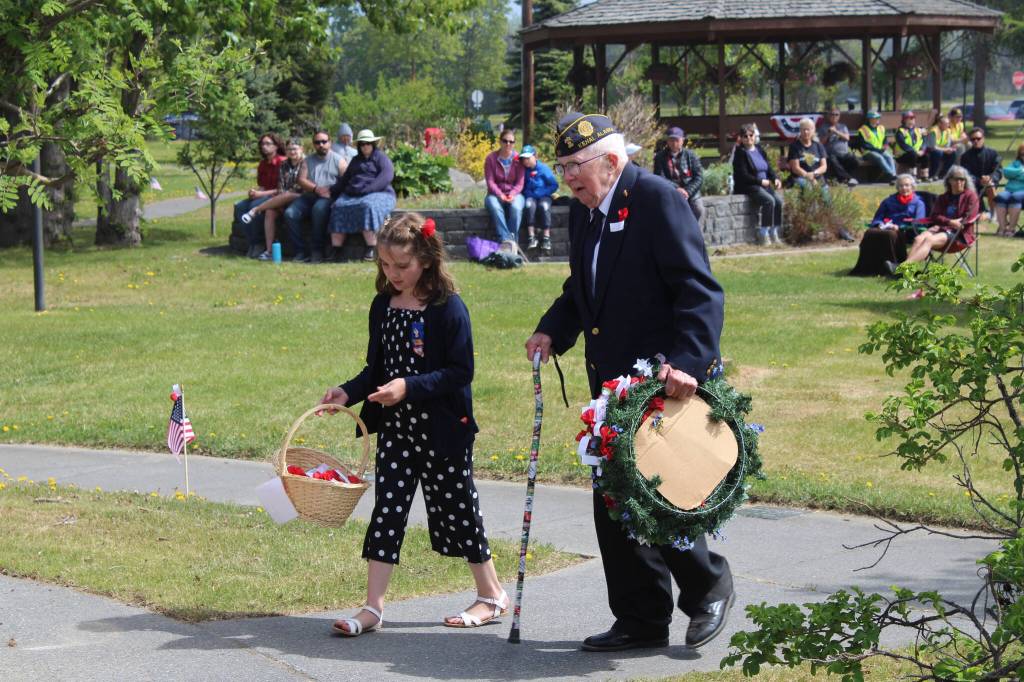 People participate in the Memorial Day ceremony at Leif Hansen Memorial Park in Kenai, Alaska, on Monday, May 30, 2022. (Camille Botello/Peninsula Clarion)