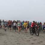 Racers take off from the start line at the Kasilof River Special Use Area for Cook Inletkeepers annual Mouth to Mouth Wild Run & Ride on Monday, May 30, 2022. To celebrate National Bike Month, the conservation organization hosted a 10-mile run, 10-mile fat bike ride, and 3-mile run, with all proceeds going toward Cook Inletkeepers mission  to ensure healthy salmon in the Cook Inlet watershed. (Camille Botello/Peninsula Clarion)