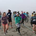 Racers take off from the start line at the Kasilof River Special Use Area for Cook Inletkeepers annual Mouth to Mouth Wild Run & Ride on Monday, May 30, 2022. To celebrate National Bike Month, the conservation organization hosted a 10-mile run, 10-mile fat bike ride, and 3-mile run, with all proceeds going toward Cook Inletkeepers mission  to ensure healthy salmon in the Cook Inlet watershed. (Camille Botello/Peninsula Clarion)
