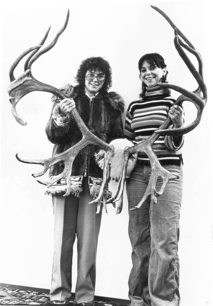 Photo provided by Marcia Grainge King 
Marcia and Mary Alice Grainge pose in 1980 with a pair of caribou antlers they found in 1972. The sisters dug the antlers from deep snow and detached them from a dead caribou.