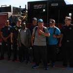 Darryl Magen, front left, and Josh Delie, front right, start their journey from the Kenai Municipal Airport on Friday, June 3, 2022 to this years Special Olympics USA Games in Orlando, Florida. (Camille Botello/Peninsula Clarion)