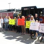 Darryl Magen, center, and Josh Delie, far right, start their journey from the Kenai Municipal Airport on Friday, June 3, 2022 to this years Special Olympics USA Games in Orlando, Florida. (Camille Botello/Peninsula Clarion)