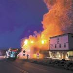 Homer Volunteer Fire Department firefighters attack the East Bunnell Avenue fire at about 3 a.m. Saturday, June 4, 2022, in Homer, Alaska. The Compass Rose building at right had minor damage from heat exposure but otherwise did not burn. (Photo courtesy of Homer Voluntee Fire Department)