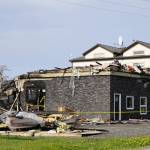 The bottom story is all that is left of a building at 177 E. Bunnell Ave. that caught fire early Saturday morning, June 4, 2022, in Homer, Alaska. Two people and their pets living in an apartment on the side closest to the road escaped injury. Homer Volunteer Fire Department, Kachemak Emergency Services and Western Emergency Services worked until about noon on Saturday to fully extinguish the fire. The Compass Rose Building to the right had some minor damage such as cracked windows from heat exposure. (Photo by Michael Armstrong/Homer News)