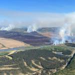 In this aerial photo provided by the BLM Alaska Fire Service, the East Fork Fire burns about 25 miles north of St. Marys, Alaska on June 2. The largest documented wildfire ever burning through tundra in southwest Alaska is within miles of two Alaska Native villages, prompting dozens of residents with respiratory problems to voluntarily evacuate. (Pat Johnson, BLM Alaska Fire Service via AP)